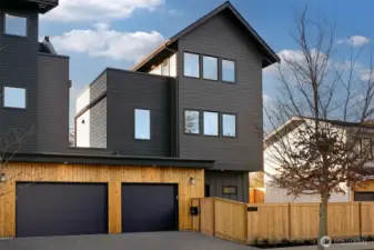 Front of the ADU home.  Three stories with a lovely yard fully fenced.