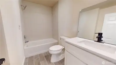 Lower Level Full Bathroom, Heated Floors Quartz Countertop and work still being completed. Beautiful Bathroom!!