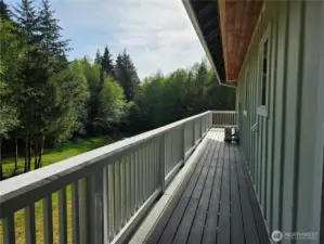 Wrap around Deck walk way to front Half Covered Deck, Bat & Board siding up top and Hardi Plank siding below this!!