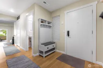 Inviting entry with a storage closet to the right and to the left is the updated half bath
