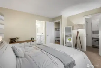 Primary bathroom to your left and walk in closet to your right