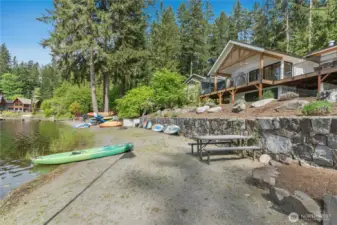 The sandy beach is perfect for launching paddle boards or kayaks.