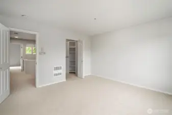 Bright hallway connecting bedrooms as seen from the master suite