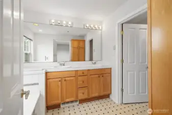 Bright master bath with double vanity and ample storage
