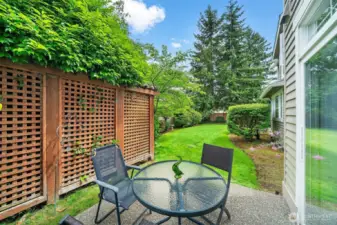 Neighbor’s well-kept backyard visible from your private patio setting