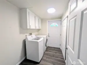 Large laundry room with cabinets and a closet as well as room for shelving or ?