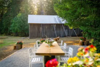 The outdoor dining space looking toward the historical barn.