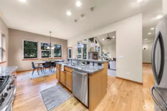 Open floor plan with large kitchen having stainless steel appliances
