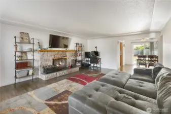 big family room with elegant fireplace and mantle.