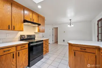 Access to garage is through the left door. The right door leads to the primary suite, separate from guest bedrooms.