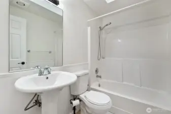 Light and bright main bathroom.