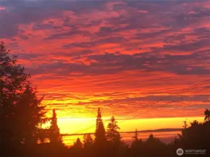 Enjoy Dramatic Sunsets over Puget Sound from this stunning Edmonds home.