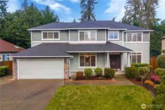Classic architecture with timeless curb appeal. An inviting covered front porch welcomes guests in style.
