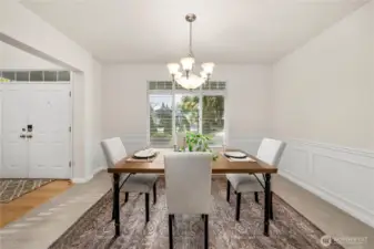 Formal dining room enhanced with classic wainscoting.