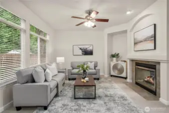 Comfortable family room designed for everyday living. Striking two-way fireplace adds warmth and ambiance.