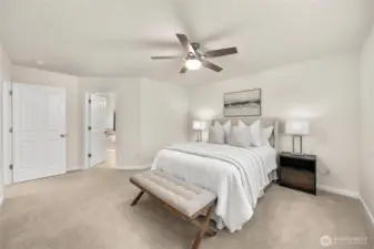 Private and serene primary bedroom with a private bath and walk-in closet.