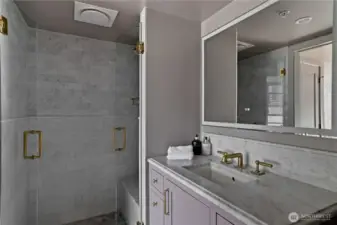 Primary suite bathroom with radiant heated floors.