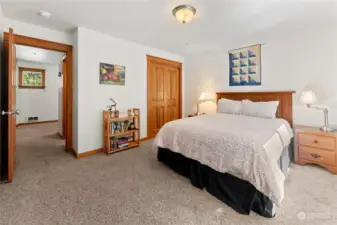 Upper Bedroom 2 is carpeted and bright with South facing windows.