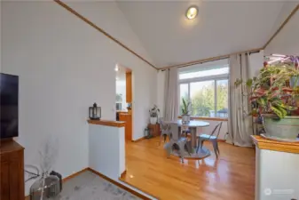 Dining area with oak floors.