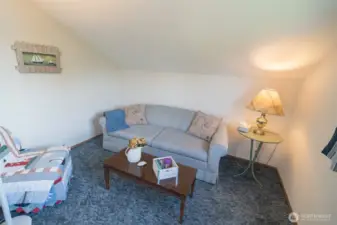 Living room at the top of the stairs.