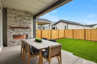 Covered patio with exterior fireplace