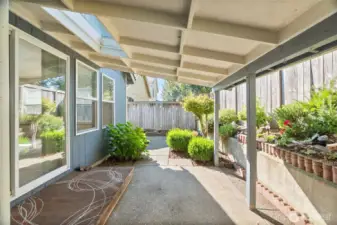 Covered area over patio W skylight.