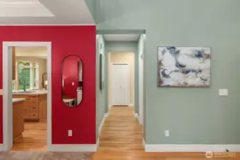 Kitchen off entry. Hallway leads to utility room and garage entrance.