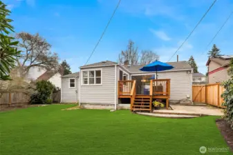 Large, level back yard offer endless options.  Green grass was photoshopped in for parts of the yard.