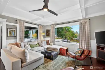 Large windows overlooking the front porch and side yard.