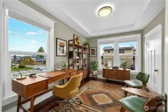 Main level office or den space located just off the living room offers flexibility. In this picture this room is virtually staged, currently being used as a play room.