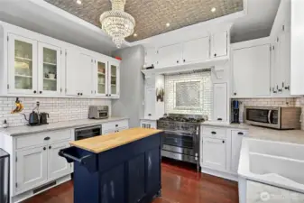 Beautiful kitchen with wood floors, white subway tile and classic details.