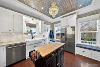 Stainless appliances and function kitchen island with butcher block.
