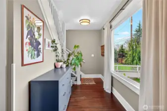 Entry area overlooks the front yard; stairs to the second level with additional 3 bedrooms/2 baths.