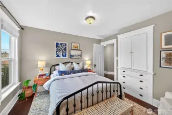 View of second bedroom with classic built-ins.