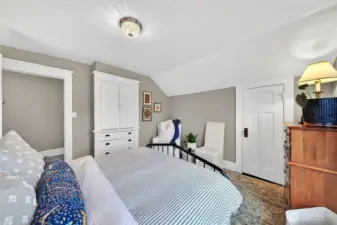 View of second bedroom with closet and built-ins.