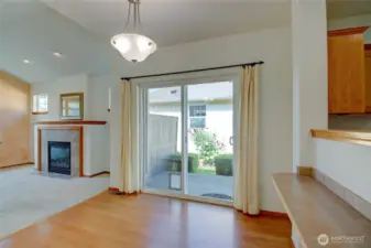 Dining area slider leads to patio and small garden.