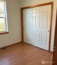 Bedroom 3 or could be office or den. It is in a central location close to kitchen.