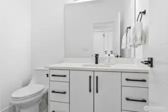 Hall bathroom between garage and kitchen