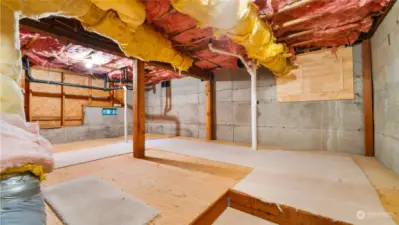 Crawl space is partially finished and is perfect for additional storage.
