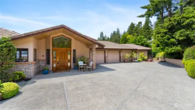 Ample parking and a dramatic entry to this Pointe home.