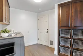 Large laundry room with tons of storage.