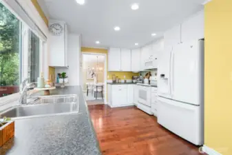 Kitchen with entry to dining room at the back.