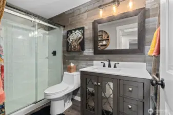 Tastefully updated upstairs guest bathroom.