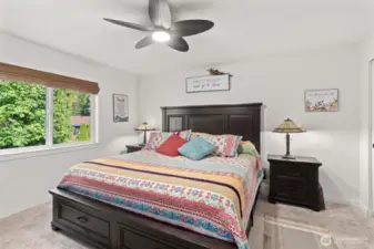 Primary bedroom with upgraded ceiling fan.