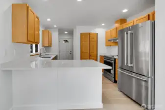 Quartz counters. Room for bar stools here.