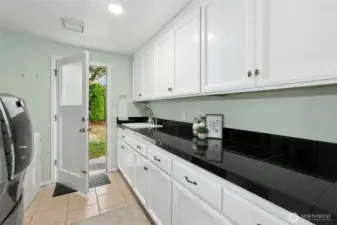 Spacious laundry with extra counter space for entertaining.