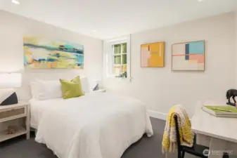 Lower level rec room with excellent ceiling height.