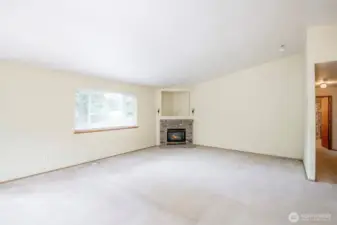 Oversized living rom with gas fireplace.