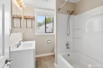Full bathroom. Has in floor heat, Bluetooth speaker