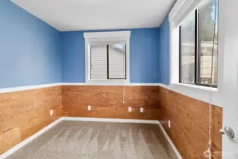 3rd bedroom. Owner had fireproof corkboard installed. It's a nice and unique look!